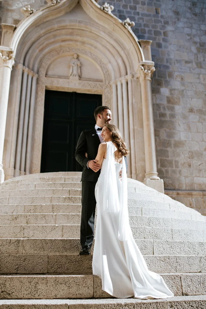 bride and groom posing in dubrovnik old town